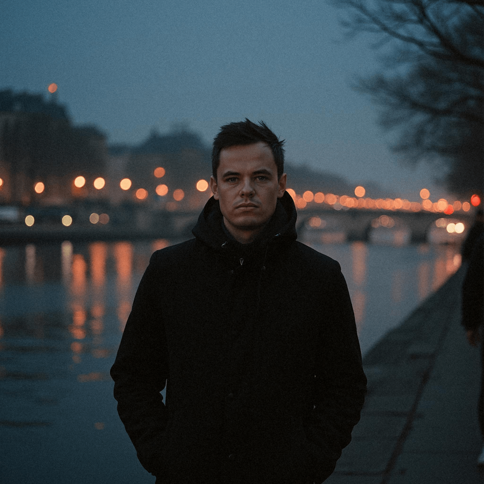 Man Walking Along Seine at Night